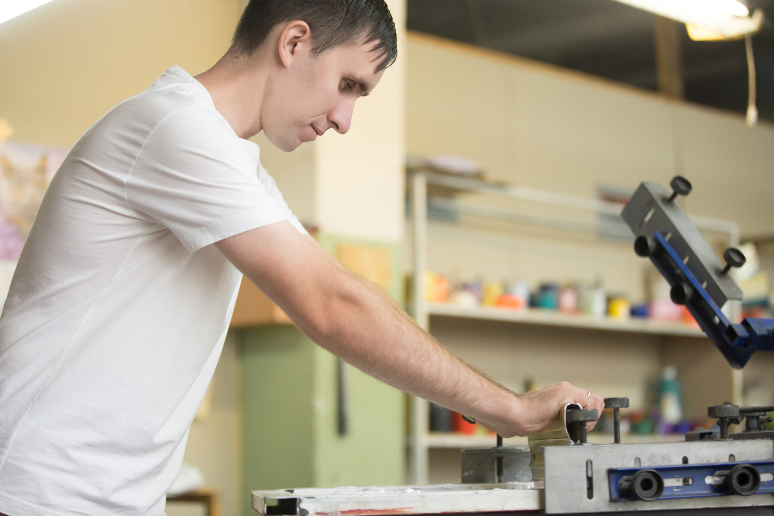 Young man screen printing young man screen printing scaled
