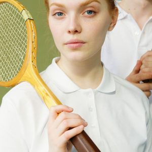Staff member in a white polo shirt